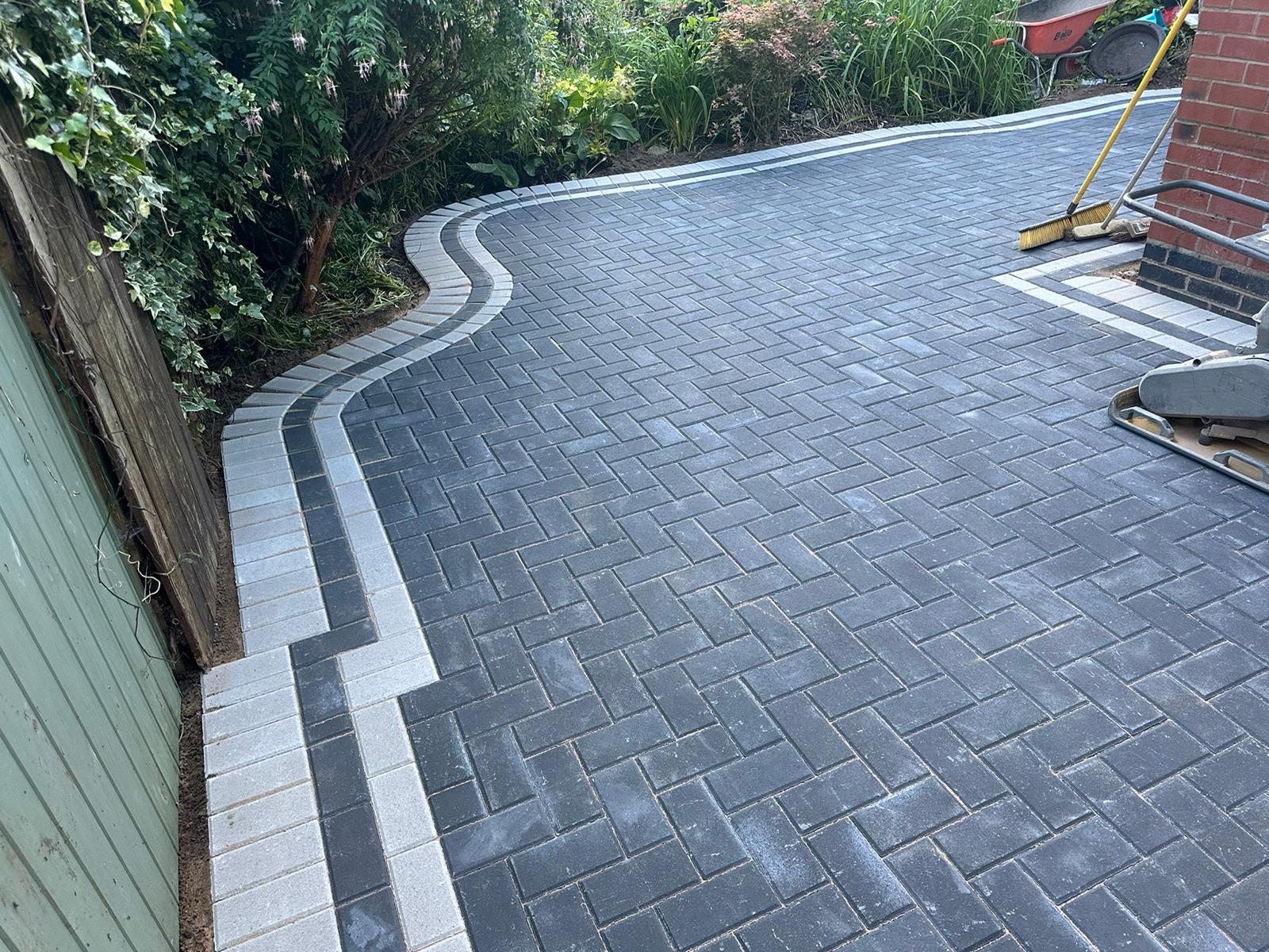 Driveway Care and maintenance Black driveway looking pristine